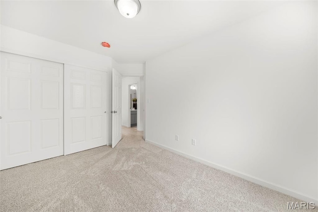 3063 Pirogue St, Saint Charles, MO 63301 - unfurnished bedroom with light carpet, baseboards, and a closet
