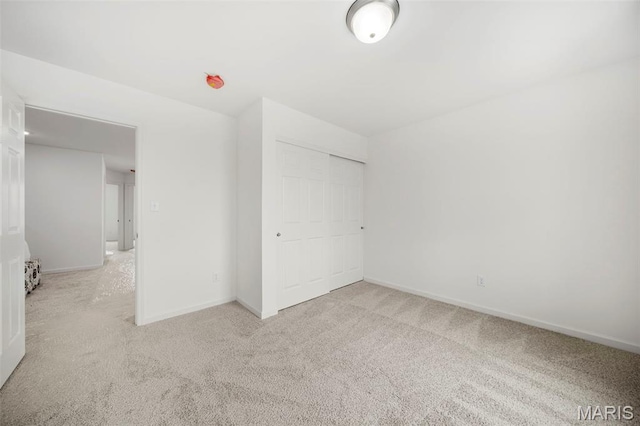 3063 Pirogue St, Saint Charles, MO 63301 - unfurnished bedroom featuring carpet, a closet, and baseboards