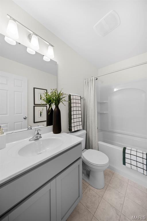 3063 Pirogue St, Saint Charles, MO 63301 - bathroom featuring vanity, tile patterned flooring, toilet, and shower / tub combo with curtain