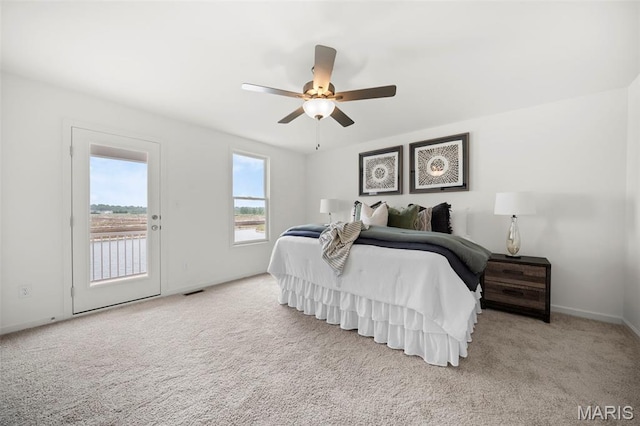 3063 Pirogue St, Saint Charles, MO 63301 - carpeted bedroom featuring access to exterior, baseboards, and ceiling fan