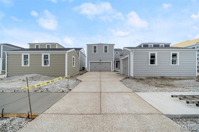3063 Pirogue St, Saint Charles, MO 63301 - rear view of house with an attached garage and driveway