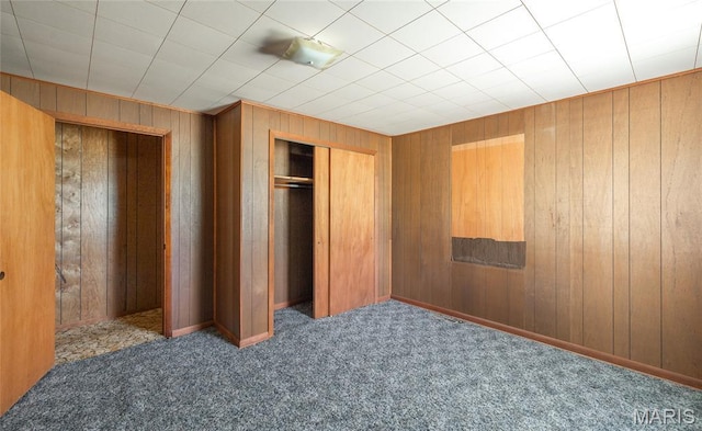18795 S US Highway 63, Rolla, MO 65401 - unfurnished bedroom with carpet floors, wooden walls, and a closet