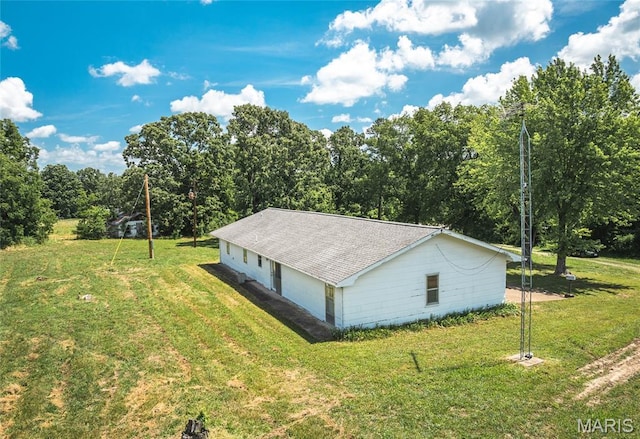 18795 S US Highway 63, Rolla, MO 65401 - view of side of home with a detached garage, a yard, and roof with shingles
