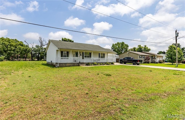 108 Karen St, Sikeston, MO 63801 - single story home with a porch, concrete driveway, and a front lawn