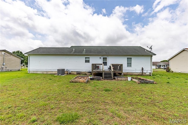 108 Karen St, Sikeston, MO 63801 - rear view of property with a garden, central air condition unit, a deck, and a yard