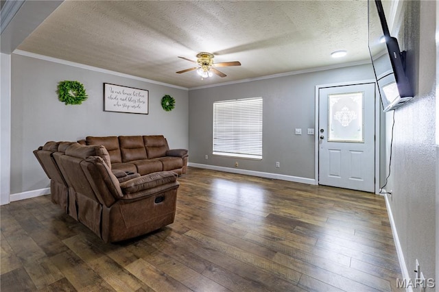 108 Karen St, Sikeston, MO 63801 - living area with a ceiling fan, ornamental molding, dark wood-style floors, baseboards, and a textured ceiling