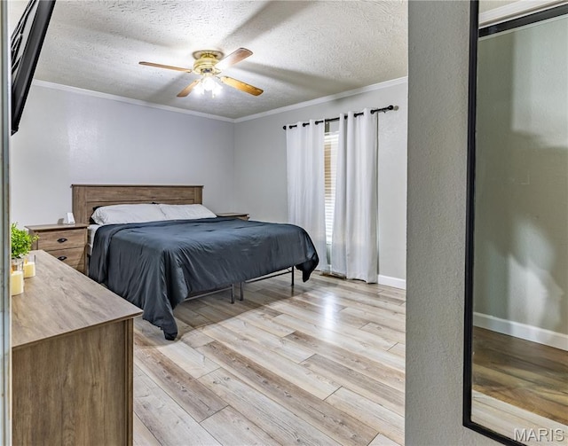108 Karen St, Sikeston, MO 63801 - bedroom featuring light wood finished floors, crown molding, a textured ceiling, baseboards, and a ceiling fan