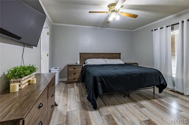 108 Karen St, Sikeston, MO 63801 - bedroom with light wood finished floors, a textured ceiling, and ceiling fan