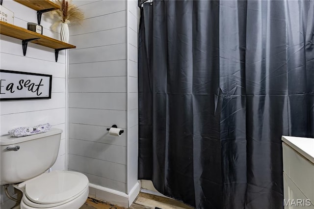 108 Karen St, Sikeston, MO 63801 - full bath with toilet, vanity, curtained shower, and wood finished floors