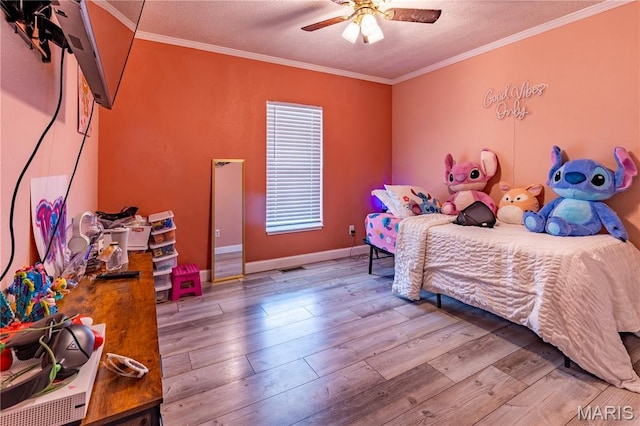 108 Karen St, Sikeston, MO 63801 - bedroom with hardwood / wood-style flooring, crown molding, a textured ceiling, a ceiling fan, and baseboards