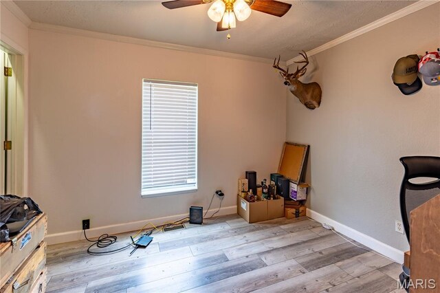 108 Karen St, Sikeston, MO 63801 - misc room featuring ornamental molding, wood finished floors, ceiling fan, and baseboards