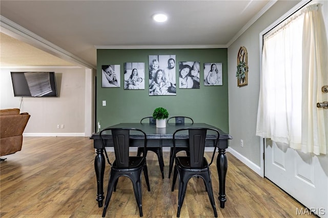 108 Karen St, Sikeston, MO 63801 - dining space with crown molding, baseboards, and wood finished floors