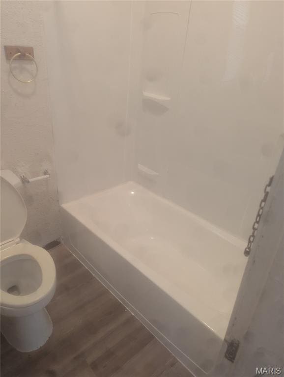 5257 Theodosia Ave, Saint Louis, MO 63113 - bathroom featuring toilet, wood finished floors, and washtub / shower combination