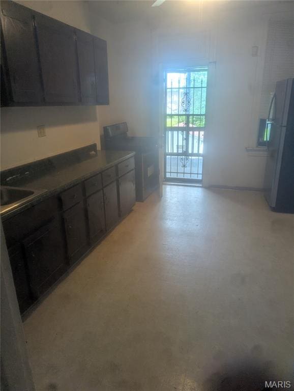 5257 Theodosia Ave, Saint Louis, MO 63113 - kitchen with freestanding refrigerator and a sink