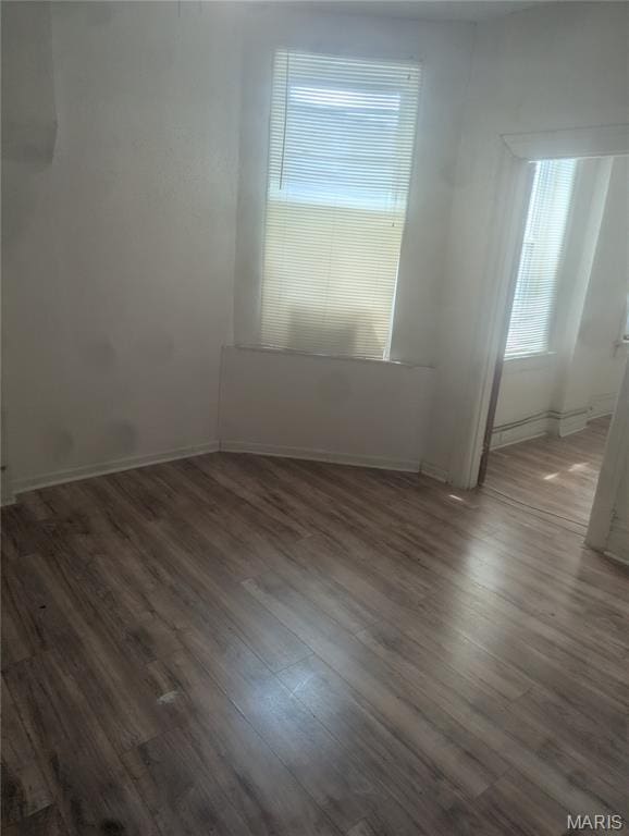 5257 Theodosia Ave, Saint Louis, MO 63113 - unfurnished room featuring wood finished floors and baseboards