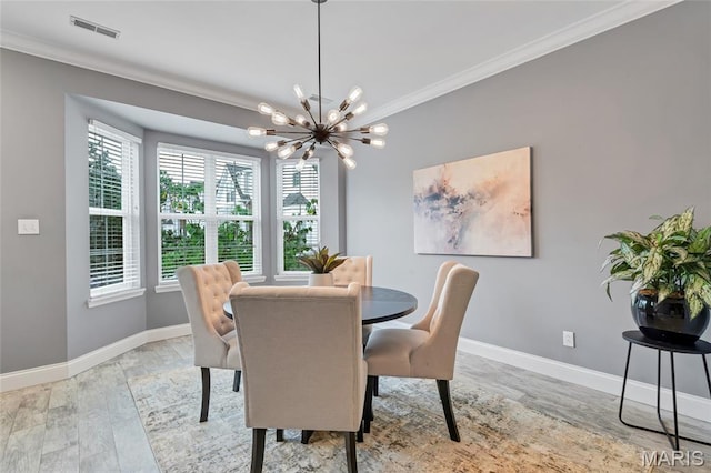 231 W Monroe Ave Unit 205, Saint Louis, MO 63122 - dining room with ornamental molding and a chandelier