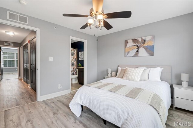 231 W Monroe Ave Unit 205, Saint Louis, MO 63122 - bedroom featuring light wood-type flooring, a ceiling fan, and connected bathroom