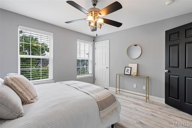 231 W Monroe Ave Unit 205, Saint Louis, MO 63122 - bedroom with light wood-type flooring, a ceiling fan, and a closet