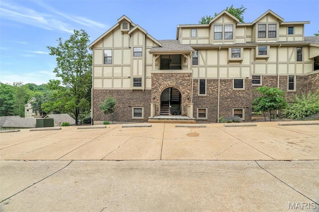 2303 Yosemite Park Ct Unit E, Maryland Heights, MO 63043 - view of property featuring uncovered parking