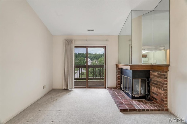 2303 Yosemite Park Ct Unit E, Maryland Heights, MO 63043 - unfurnished living room with carpet flooring, a brick fireplace, and baseboards