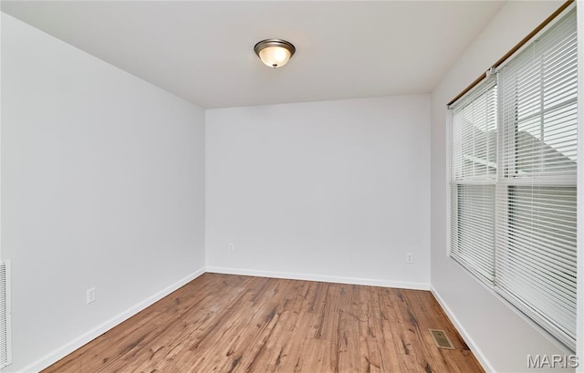 2907 Preston Woods Trl, Lake St Louis, MO 63367 - unfurnished room featuring wood finished floors and baseboards