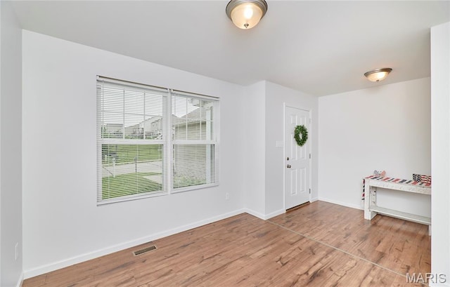 2907 Preston Woods Trl, Lake St Louis, MO 63367 - entryway with baseboards and wood finished floors