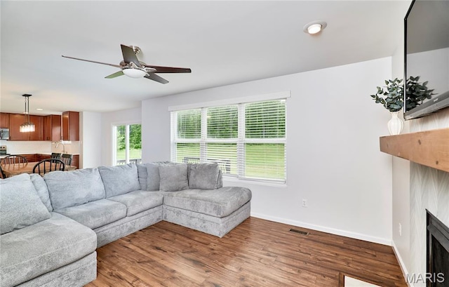 2907 Preston Woods Trl, Lake St Louis, MO 63367 - living area with a fireplace, wood finished floors, and a ceiling fan