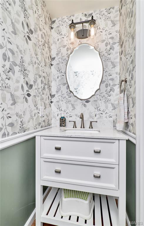 2907 Preston Woods Trl, Lake St Louis, MO 63367 - bathroom featuring wallpapered walls and vanity
