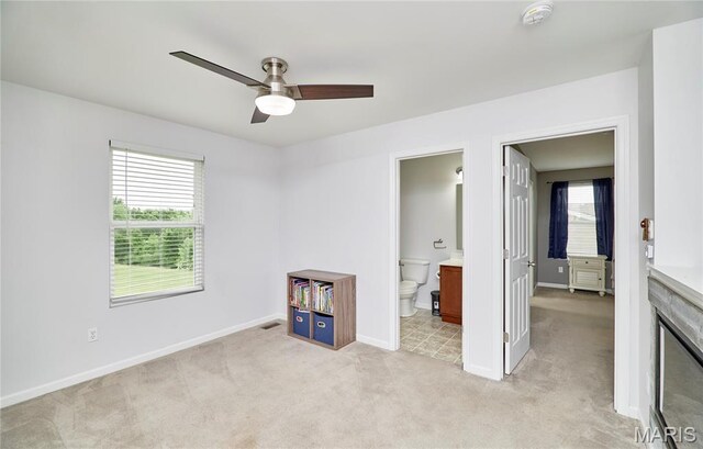2907 Preston Woods Trl, Lake St Louis, MO 63367 - unfurnished bedroom featuring light carpet, ensuite bath, and ceiling fan