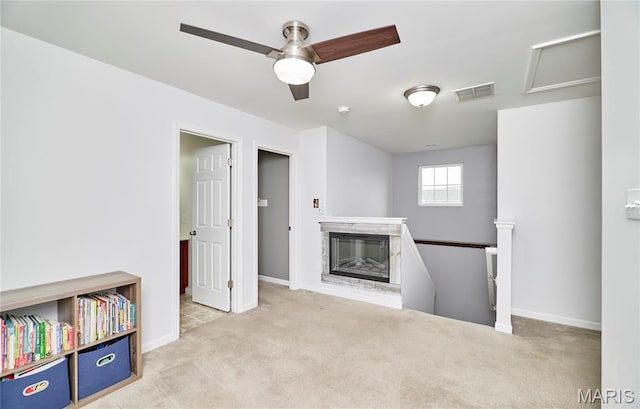 2907 Preston Woods Trl, Lake St Louis, MO 63367 - unfurnished living room featuring carpet flooring, ceiling fan, and a glass covered fireplace