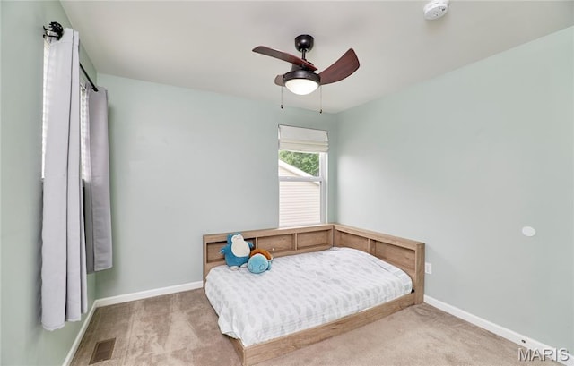 2907 Preston Woods Trl, Lake St Louis, MO 63367 - carpeted bedroom with baseboards and ceiling fan