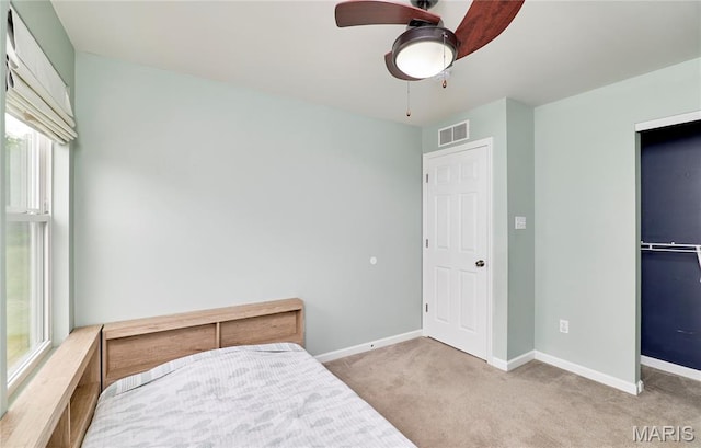 2907 Preston Woods Trl, Lake St Louis, MO 63367 - carpeted bedroom featuring baseboards and a ceiling fan