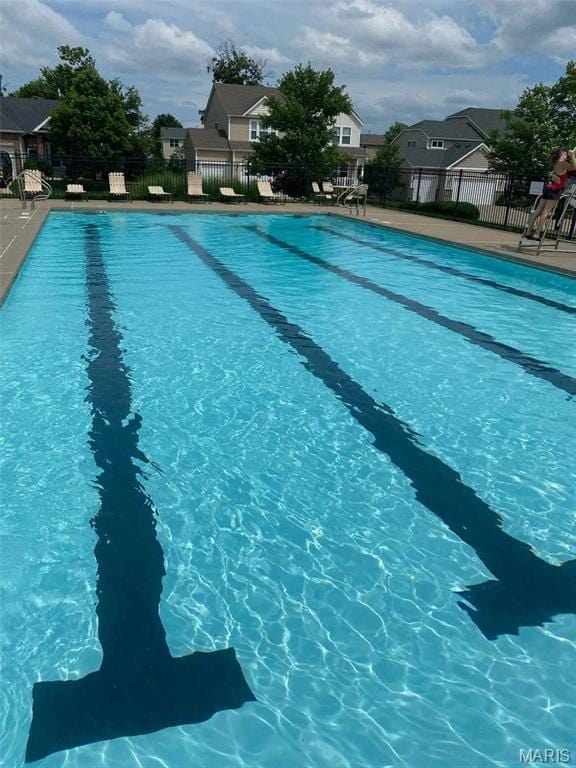 2907 Preston Woods Trl, Lake St Louis, MO 63367 - community pool featuring a residential view