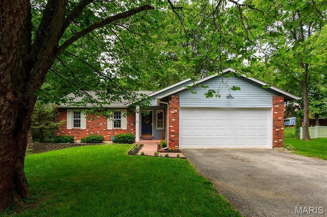 9 Donald Dr, Saint Charles, MO 63304 - ranch-style house with asphalt driveway, brick siding, and a garage