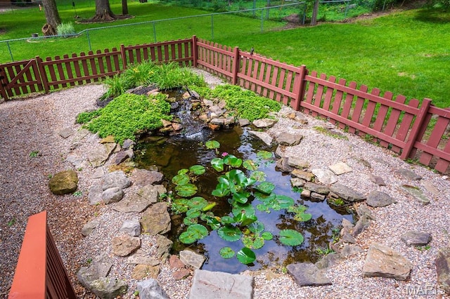 9 Donald Dr, Saint Charles, MO 63304 - view of yard featuring a garden pond