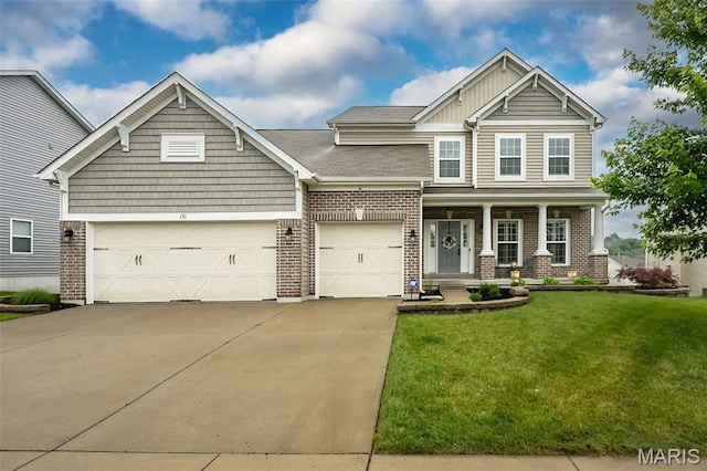 151 Wilmer Valley Dr, Wentzville, MO 63385 - craftsman inspired home featuring driveway, a front yard, a garage, brick siding, and covered porch