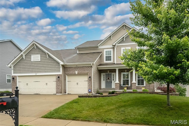 151 Wilmer Valley Dr, Wentzville, MO 63385 - craftsman house featuring concrete driveway, a front yard, brick siding, and a garage