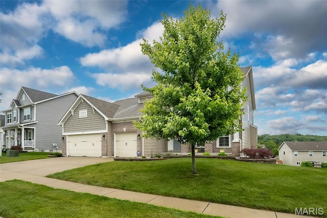 151 Wilmer Valley Dr, Wentzville, MO 63385 - view of front of home with brick siding, driveway, a front yard, and a garage