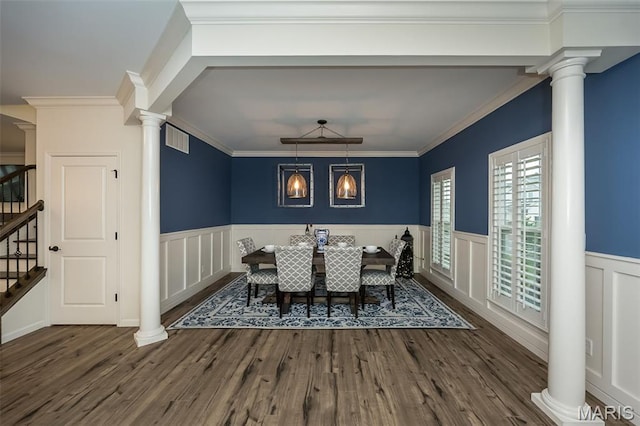 151 Wilmer Valley Dr, Wentzville, MO 63385 - dining area featuring ornate columns, stairway, a wainscoted wall, wood finished floors, and a decorative wall