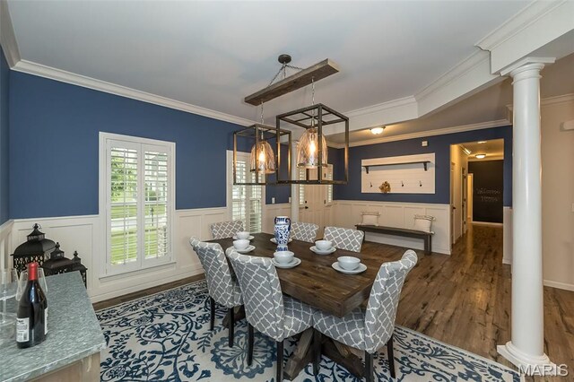 151 Wilmer Valley Dr, Wentzville, MO 63385 - dining room featuring decorative columns, wood finished floors, wainscoting, and crown molding