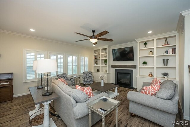 151 Wilmer Valley Dr, Wentzville, MO 63385 - living area with plenty of natural light, a ceiling fan, ornamental molding, wood finished floors, and a glass covered fireplace