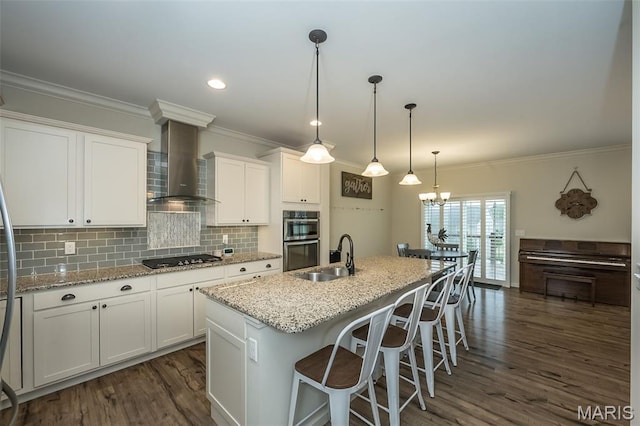 151 Wilmer Valley Dr, Wentzville, MO 63385 - kitchen featuring a sink, double oven, wall chimney exhaust hood, black electric stovetop, and white cabinets