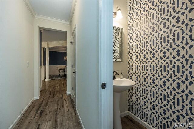 151 Wilmer Valley Dr, Wentzville, MO 63385 - bathroom featuring ornamental molding, wood finished floors, baseboards, and a sink