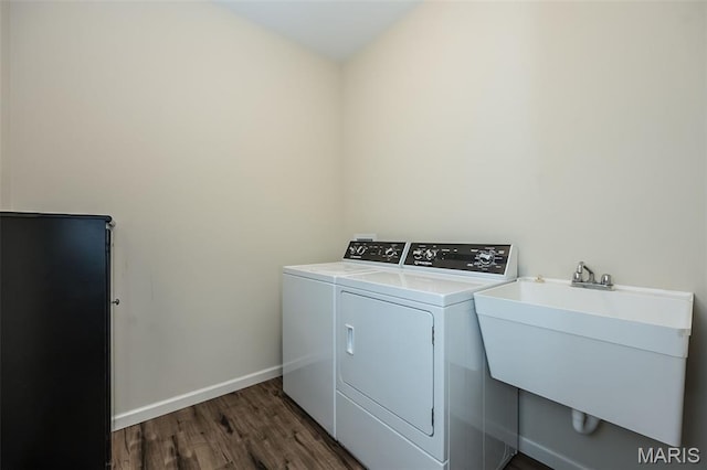 151 Wilmer Valley Dr, Wentzville, MO 63385 - laundry room with washer and clothes dryer, dark wood-style floors, and baseboards
