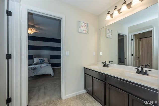 151 Wilmer Valley Dr, Wentzville, MO 63385 - ensuite bathroom with double vanity, baseboards, and a ceiling fan