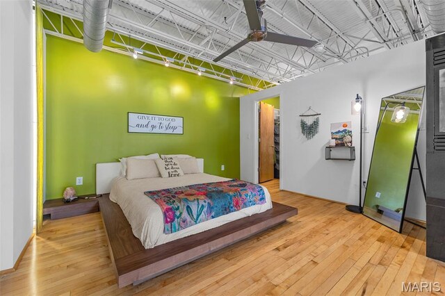 2401 S 12th St Unit 101, Saint Louis, MO 63104 - bedroom featuring hardwood / wood-style flooring and a walk in closet