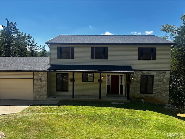 134 N Kings Rd, Lake Sherwood, MO 63357 - traditional-style home featuring stone siding, a front yard, an attached garage, and driveway