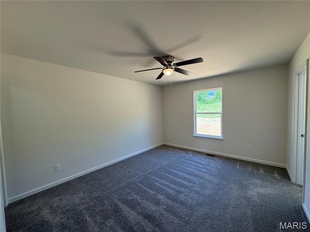 2988 Scott Rd, Moscow Mills, MO 63362 - unfurnished room with a ceiling fan, dark carpet, and baseboards