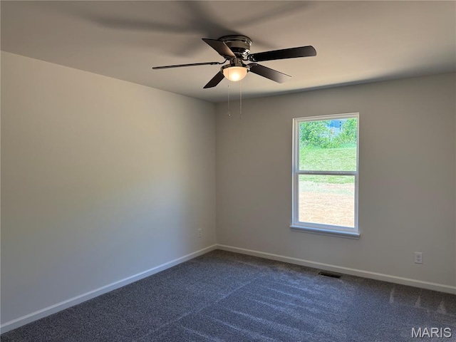 2988 Scott Rd, Moscow Mills, MO 63362 - empty room featuring a ceiling fan, baseboards, and dark carpet