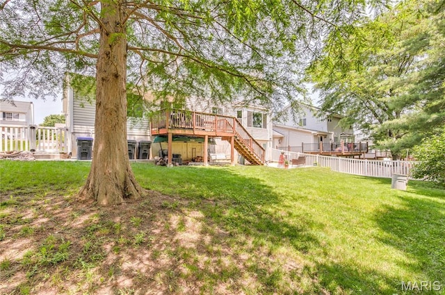 10 Forest Pine Ct, Ofallon, MO 63368 - fenced backyard with stairs and a wooden deck